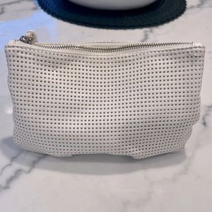 Vegan leather cosmetic bag. Lightly used, good condition, zipper closure, 9”x 6”